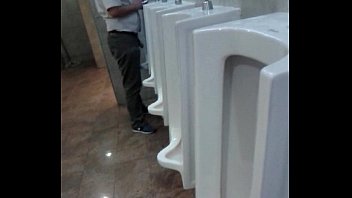 Mr. pissing in the casino bathroom