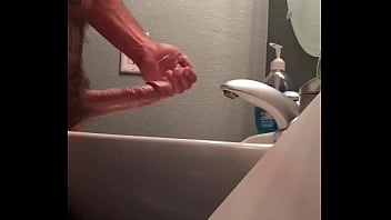 Hung man jerking off fat cock with cumshot.