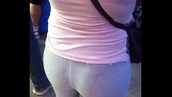 Ass in leggings waiting for the bus