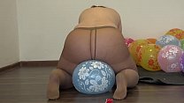 A fat girl in pantyhose sits down on balloons and pisses