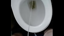man pissing in toilet