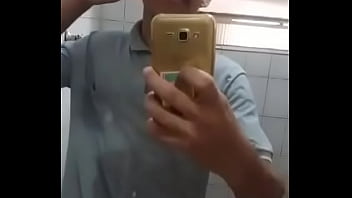 Young man masturbating in the bathroom