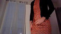 Young amateur cross dresser teasing and touching in cute orange dress and sexy black blazer after a hard day at the office