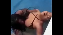 Black girls play with each other in the pool