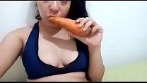 Catherine Osorio playing with carrots