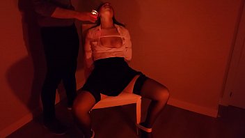 Tied to a chair and blindfolded to suck dick