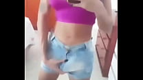 Guilhermina shows the volume of the stick in her shorts