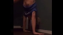 Teen doing a handstand with nip slip