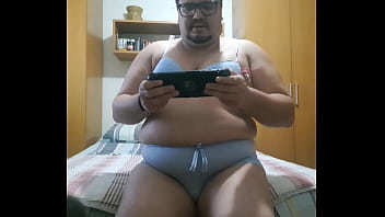chubby boy plays videogame