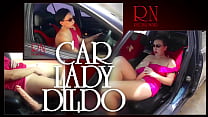 A lady masturbates in a car in a parking lot Teasing a clit with a dildo SHORT